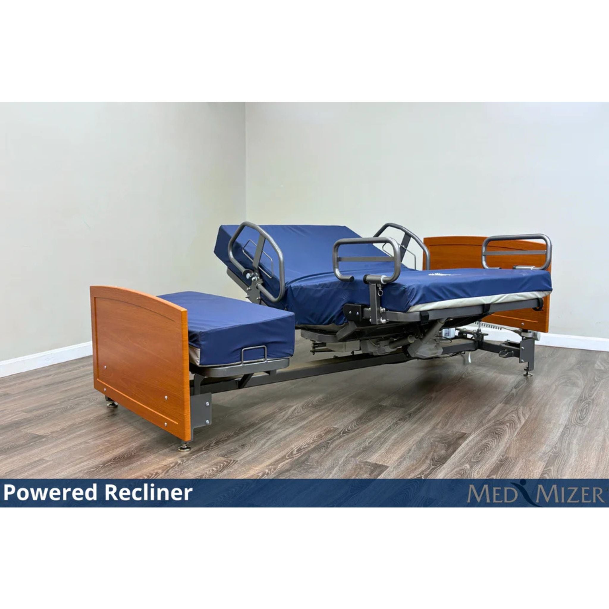 ActiveCare Fixed hospital bed reclined in powered recliner position with side safety rails and cherry wood ends