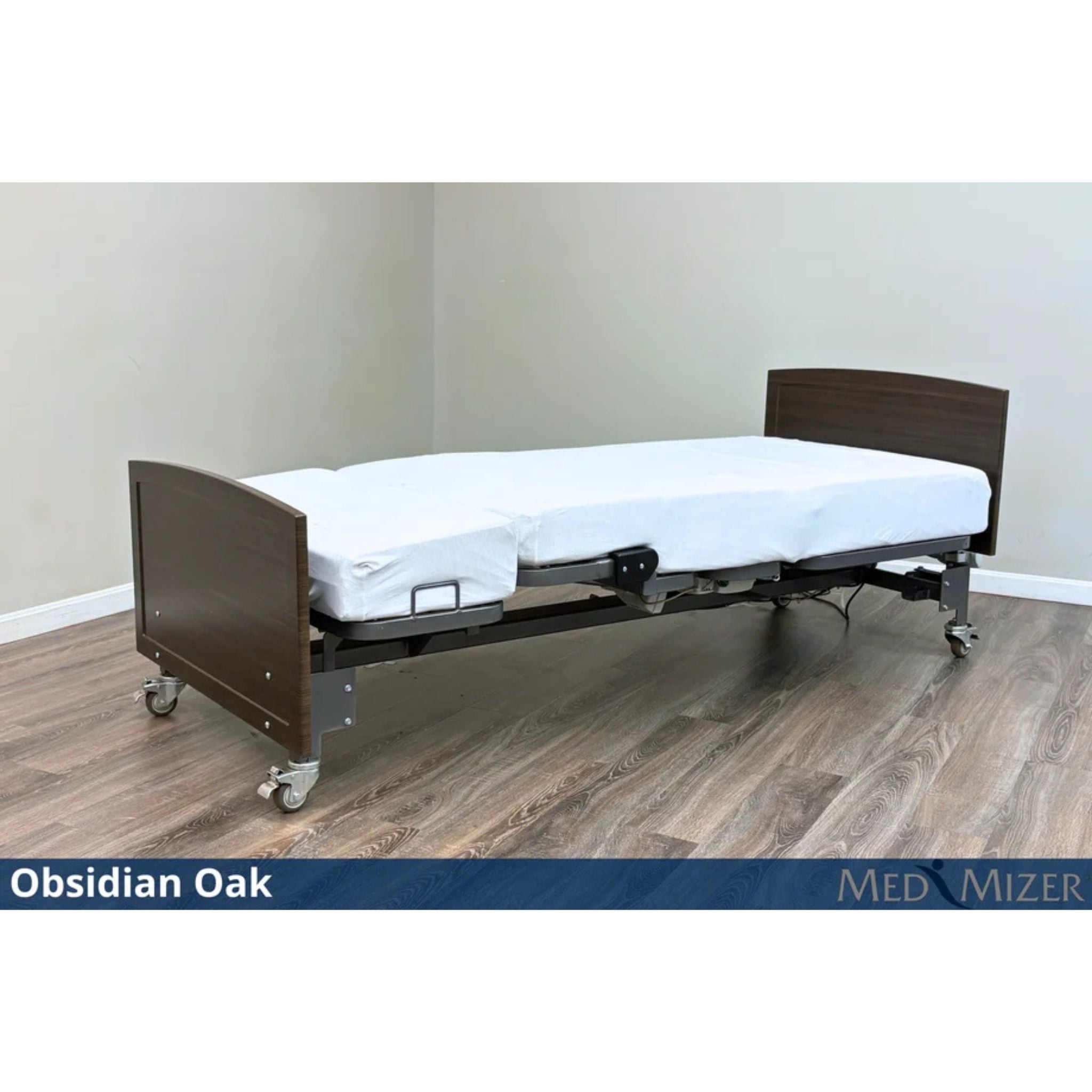 Med-Mizer ActiveCare Fixed height hospital bed flat with dark Obsidian Oak wood headboard and footboard on casters
