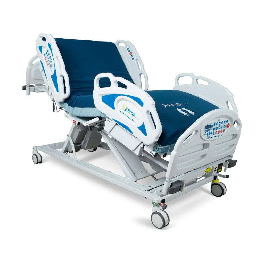 Adjustable medical bed with blue mattress, patient side rails, and electronic controls.