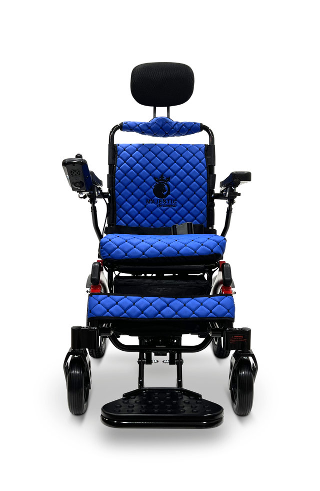 ComfyGO Majestic IQ-9000 electric wheelchair front view in blue quilted upholstery with headrest, joystick, and footplate