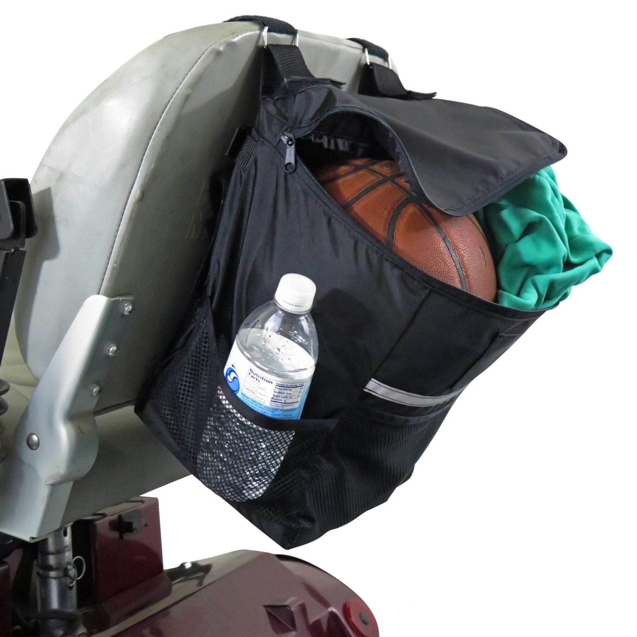 Diestco Mini Monster Bag on a power wheelchair seatback holding a basketball, shirt, and water bottle in a mesh pocket