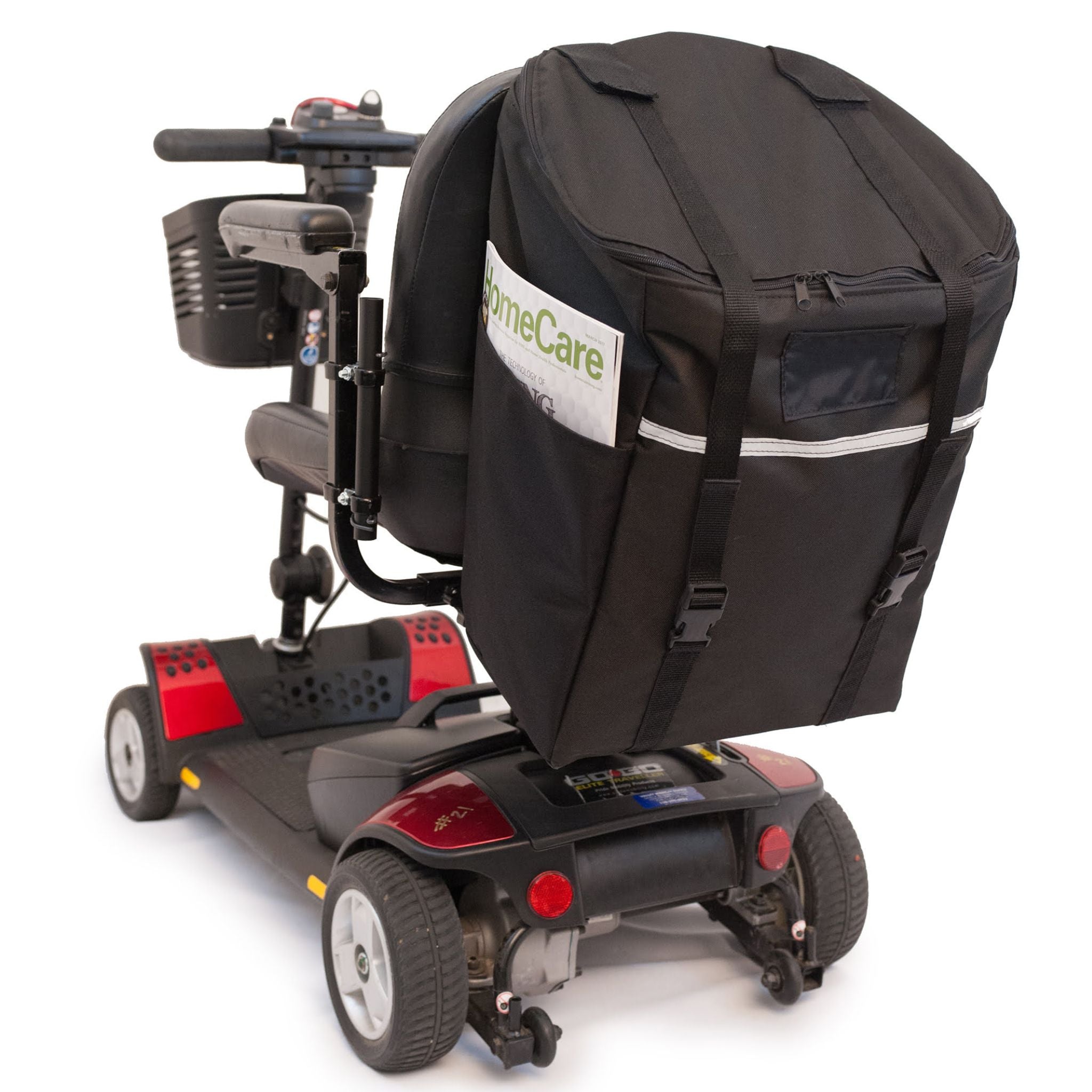 Diestco Monster Bag on a mobility scooter seatback with a magazine in the ID pocket and reflective strip