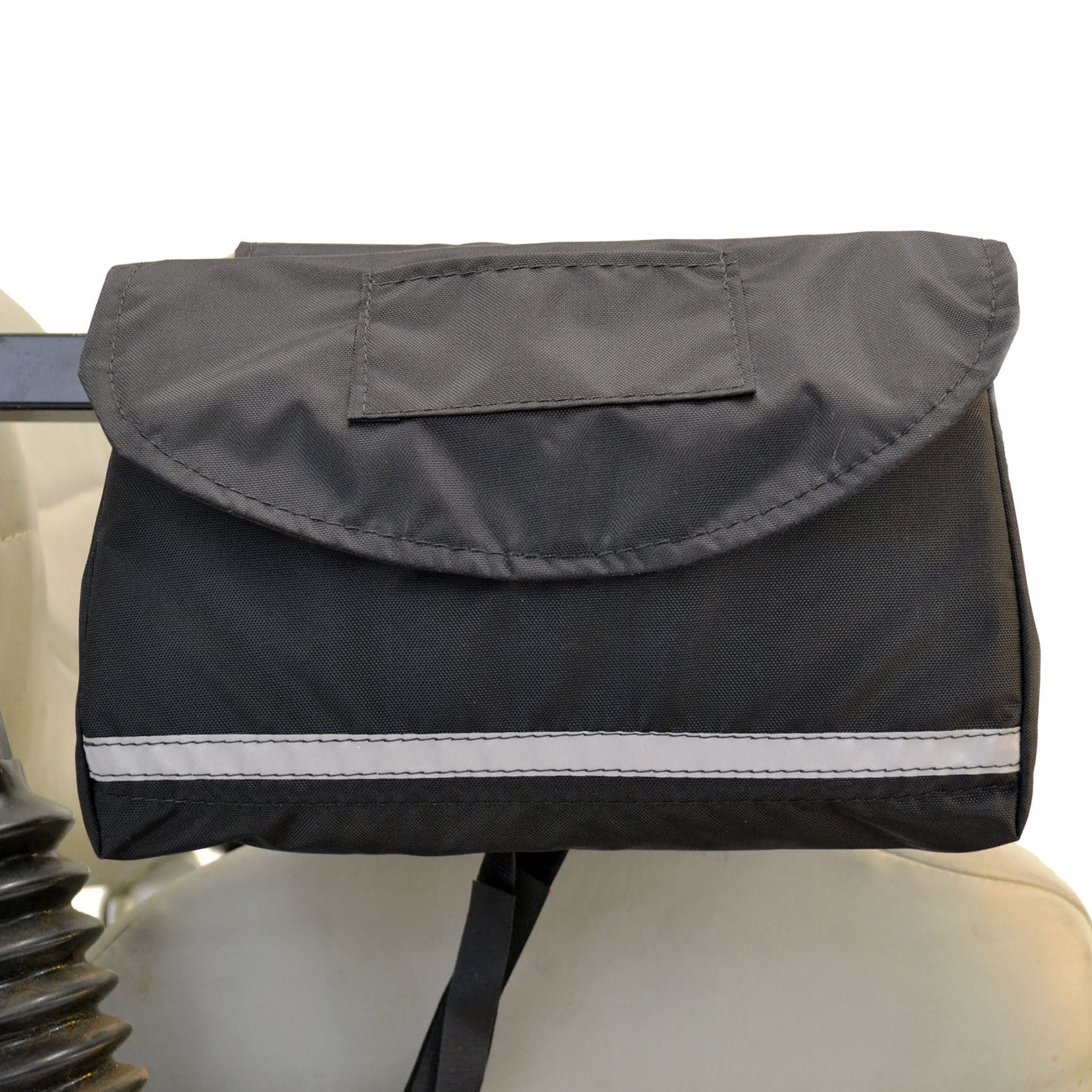 Black Diestco Standard Saddle Bag strapped to a scooter armrest with the flap closed and a reflective strip