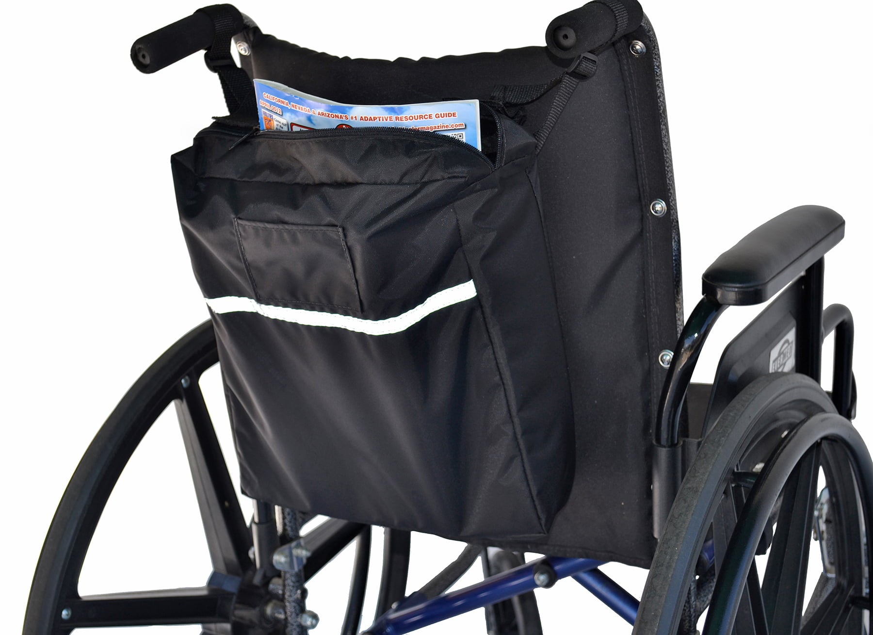 Angled view of the Diestco Standard Seatback Bag on a wheelchair showing the zipper top, ID pocket, and reflective strip