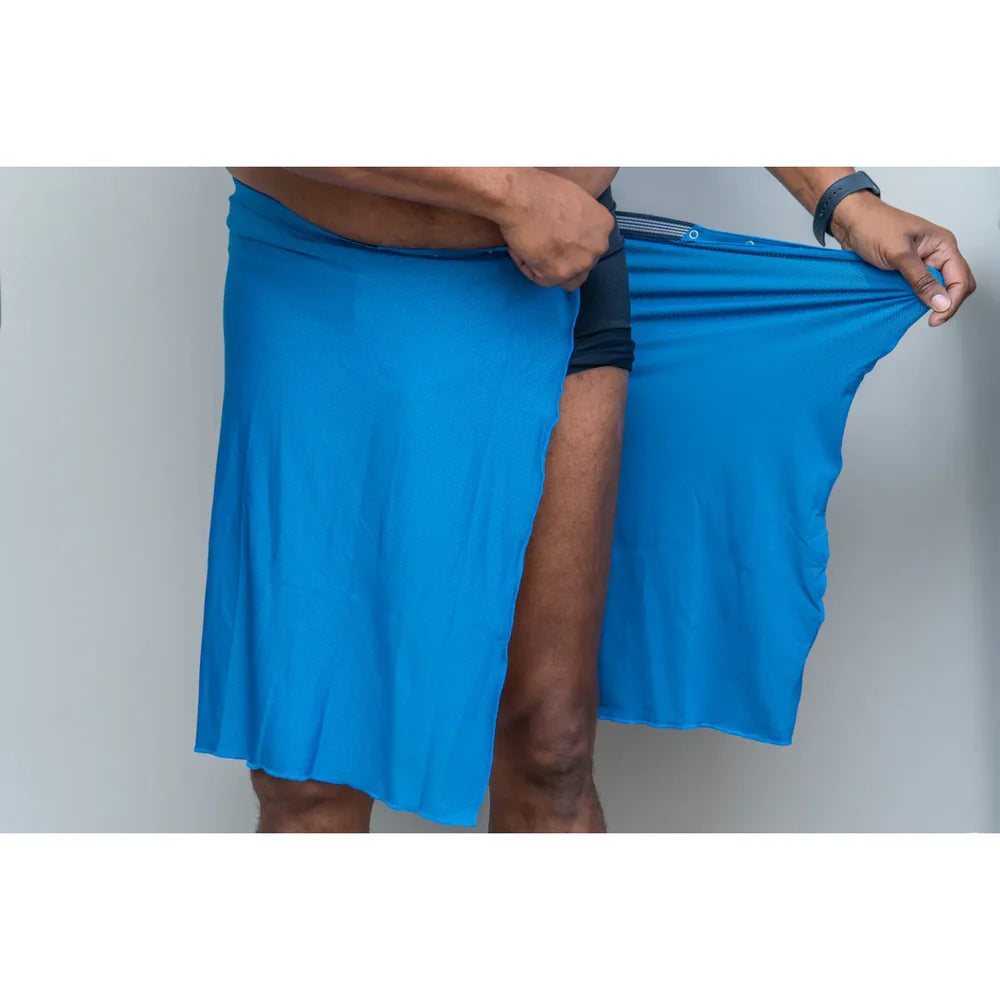 Man demonstrating stretchable quick-drying fabric of Dignity Bath & Spa Wrap