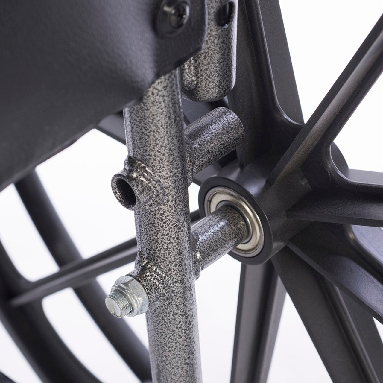 Close-up of dual axle height adjustment lever on heavy-duty bariatric wheelchair for hemi-height seat positioning and customized wheelchair mobility support.