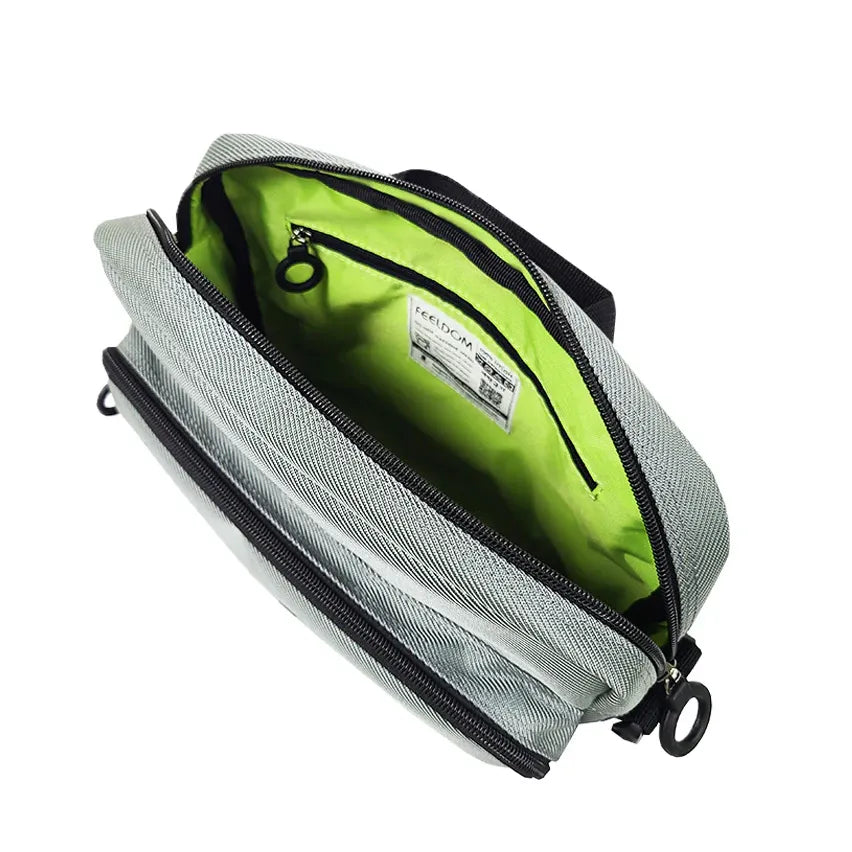 Interior view of FEELDOM MODU-Satchel adaptive bag with high-visibility lining, zipper pocket, and organized storage compartments