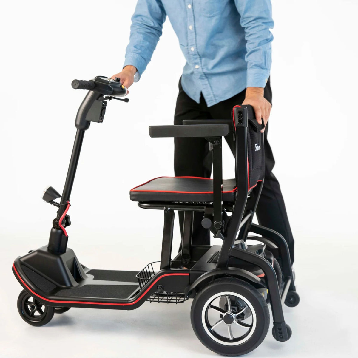 Feather Scooter with the seatback folded forward onto the seat, tiller still upright