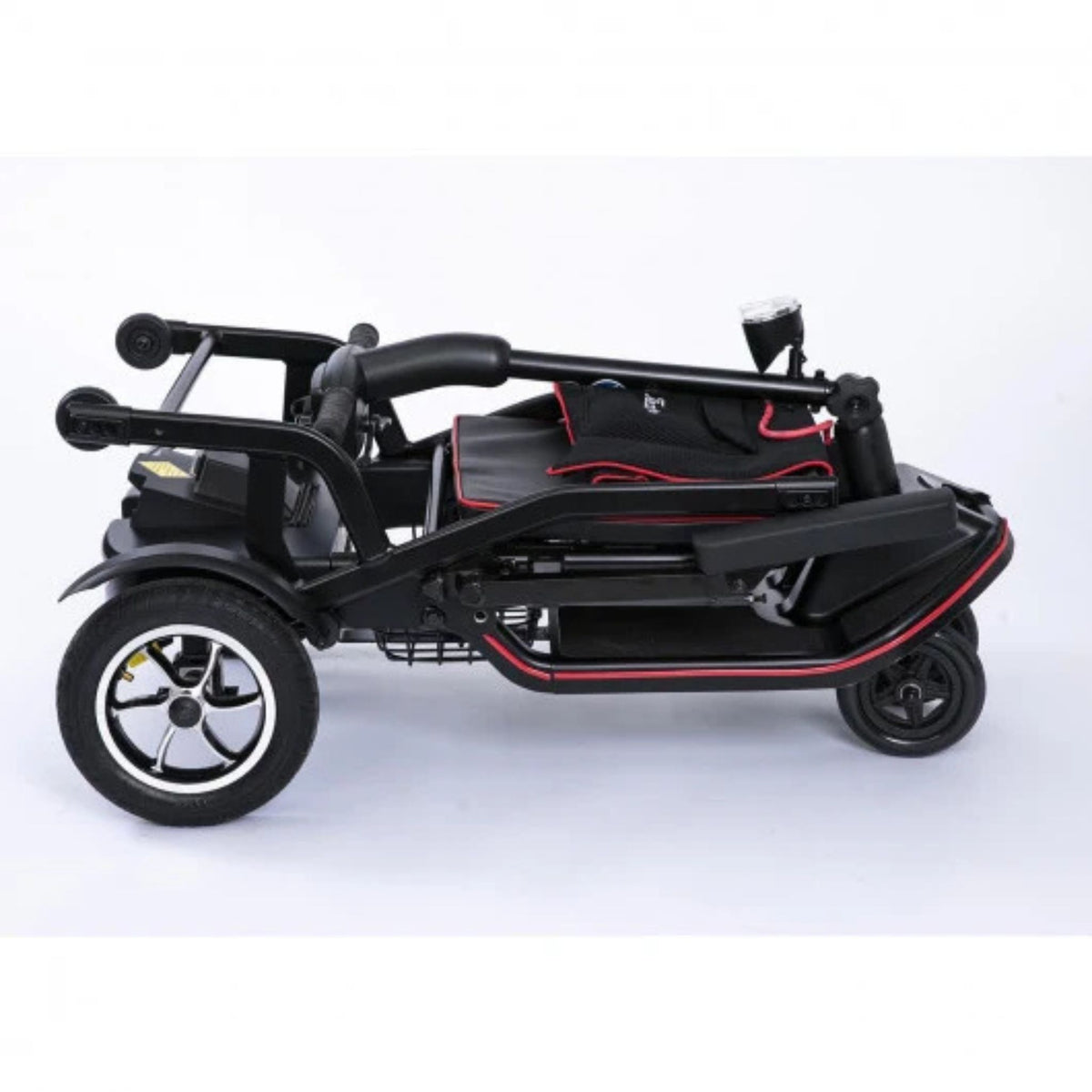 Side view of the Feather Scooter folded flat to 18 inches tall with the tiller lowered and seatback folded