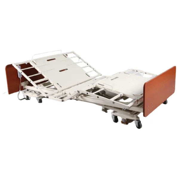 Adjustable hospital bed with caster wheels and brown wood headboard for mobility assistance
