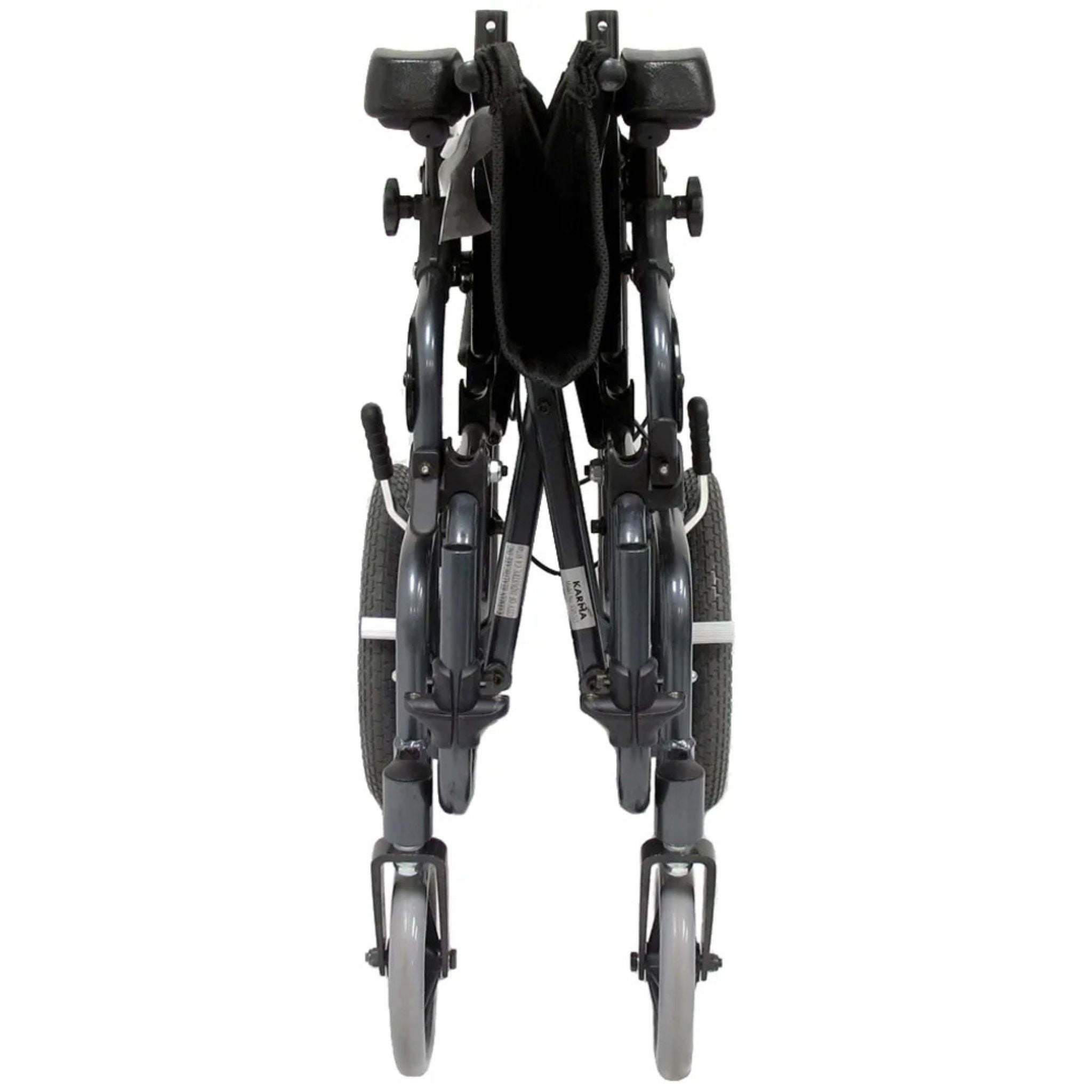 Front view of the folded Karman VIP-515 manual propel tilt-in-space wheelchair showing compact folding frame for transport and storage on a white background