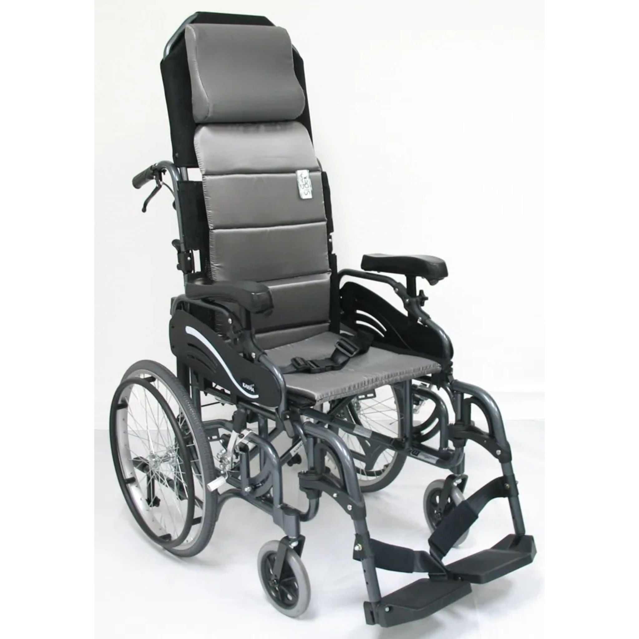 Karman VIP-515 lightweight tilt-in-space manual wheelchair with ergonomic headrest, pressure relief seating, 20-inch rear wheels, and swing-away elevating leg rests on a white background
