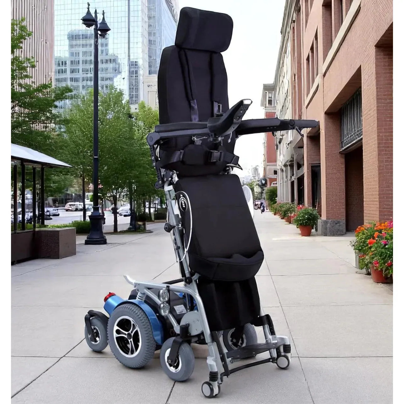 Karman XO-505 electric standing wheelchair shown in full standing position outdoors, demonstrating advanced pressure redistribution, powered mobility, postural support, circulation benefits, and independence for wheelchair users with complex positioning needs.