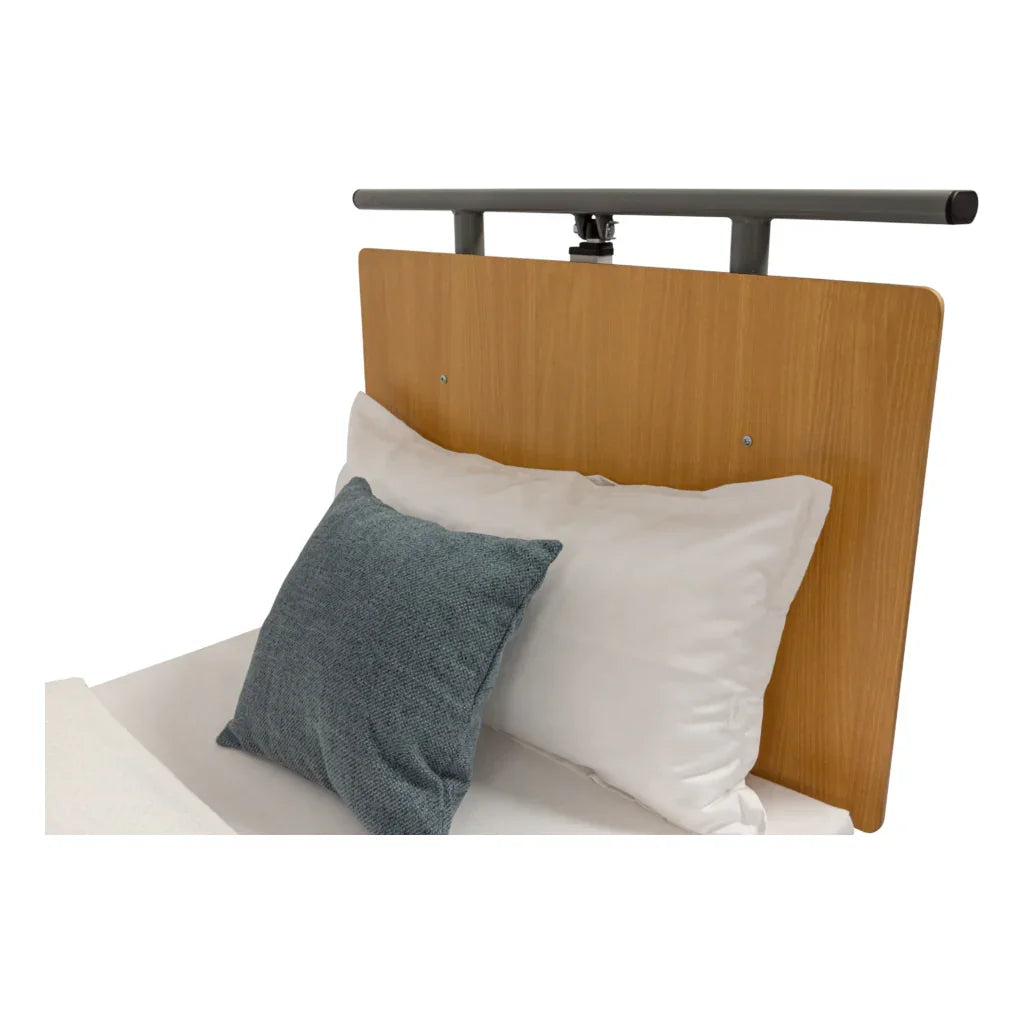 Low bed headboard with wood finish, grey support rail, and white bedding for medical beds