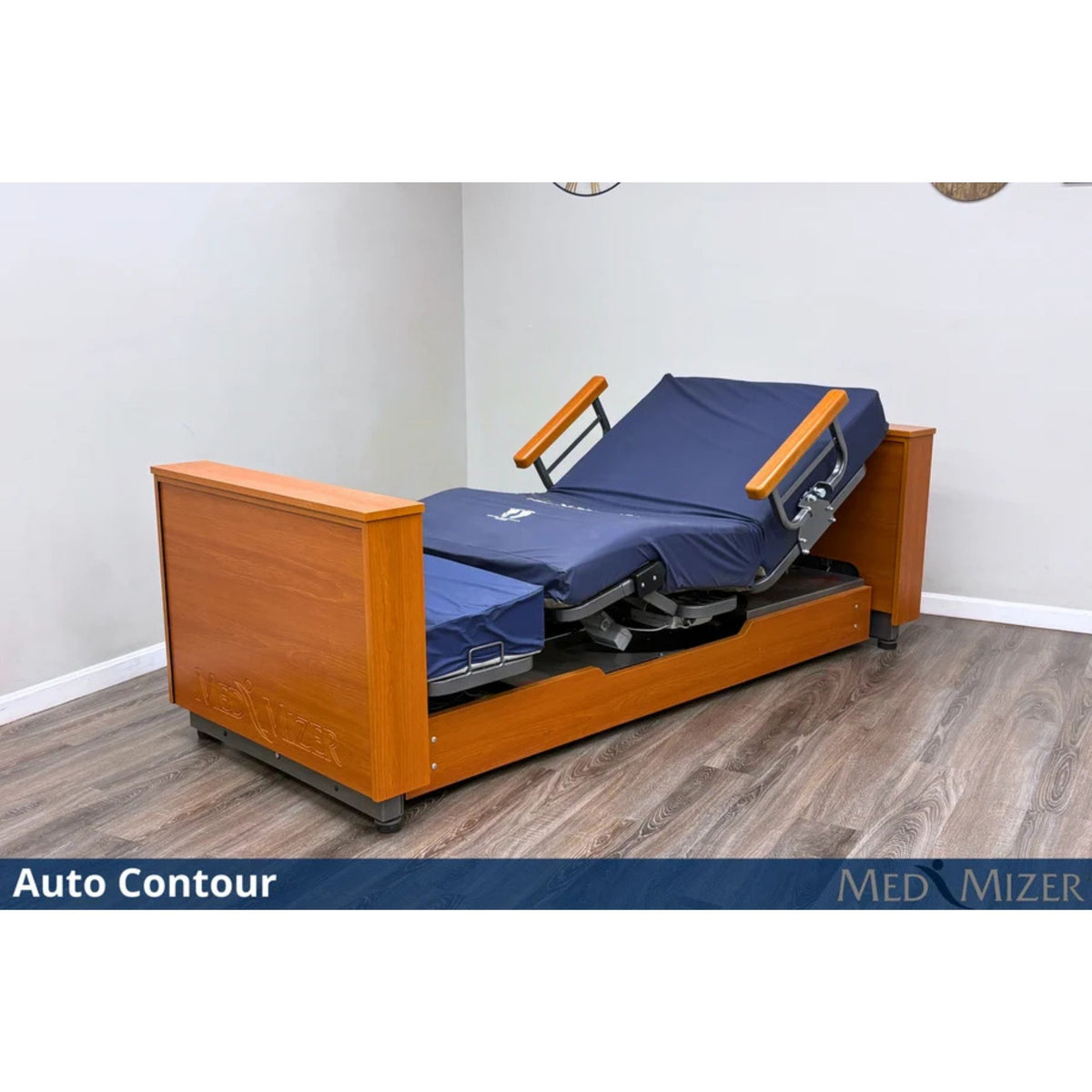 Med-Mizer ActiveCare Deluxe bed with head and knees raised in an auto contour position, wood panels and mattress