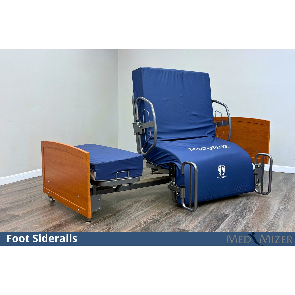 Med-Mizer ActiveCare Fixed bed rotated to seated exit showing foot siderails and blue MedMizer mattress cover