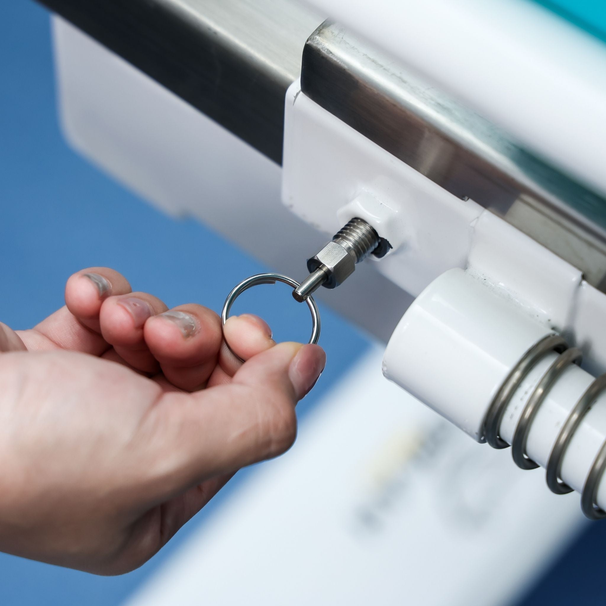 Quick-release locking pin securing adjustable components on Morgan AH Medical bathing trolley