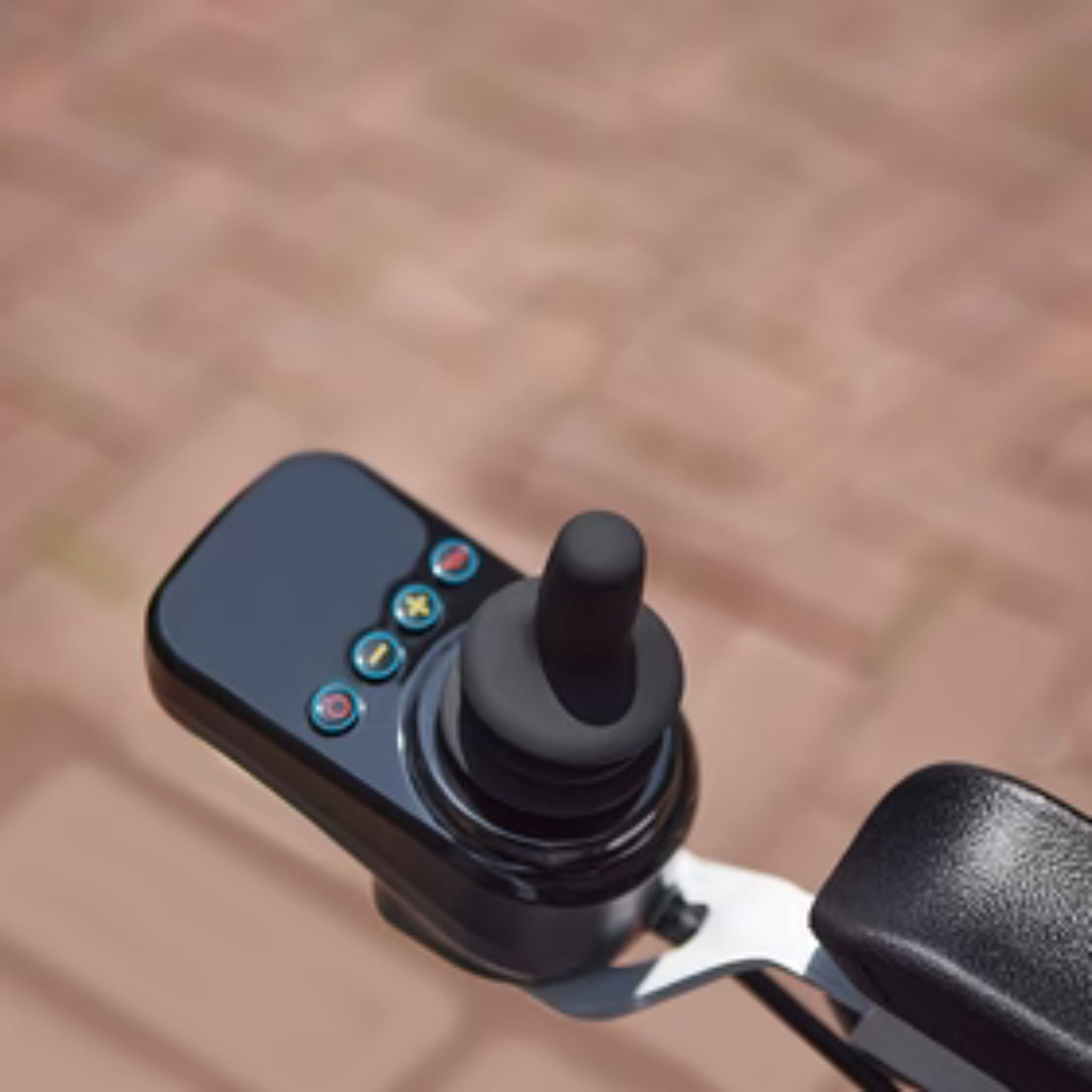 Close-up of the OAS Air Pro programmable joystick controller with speed and power controls