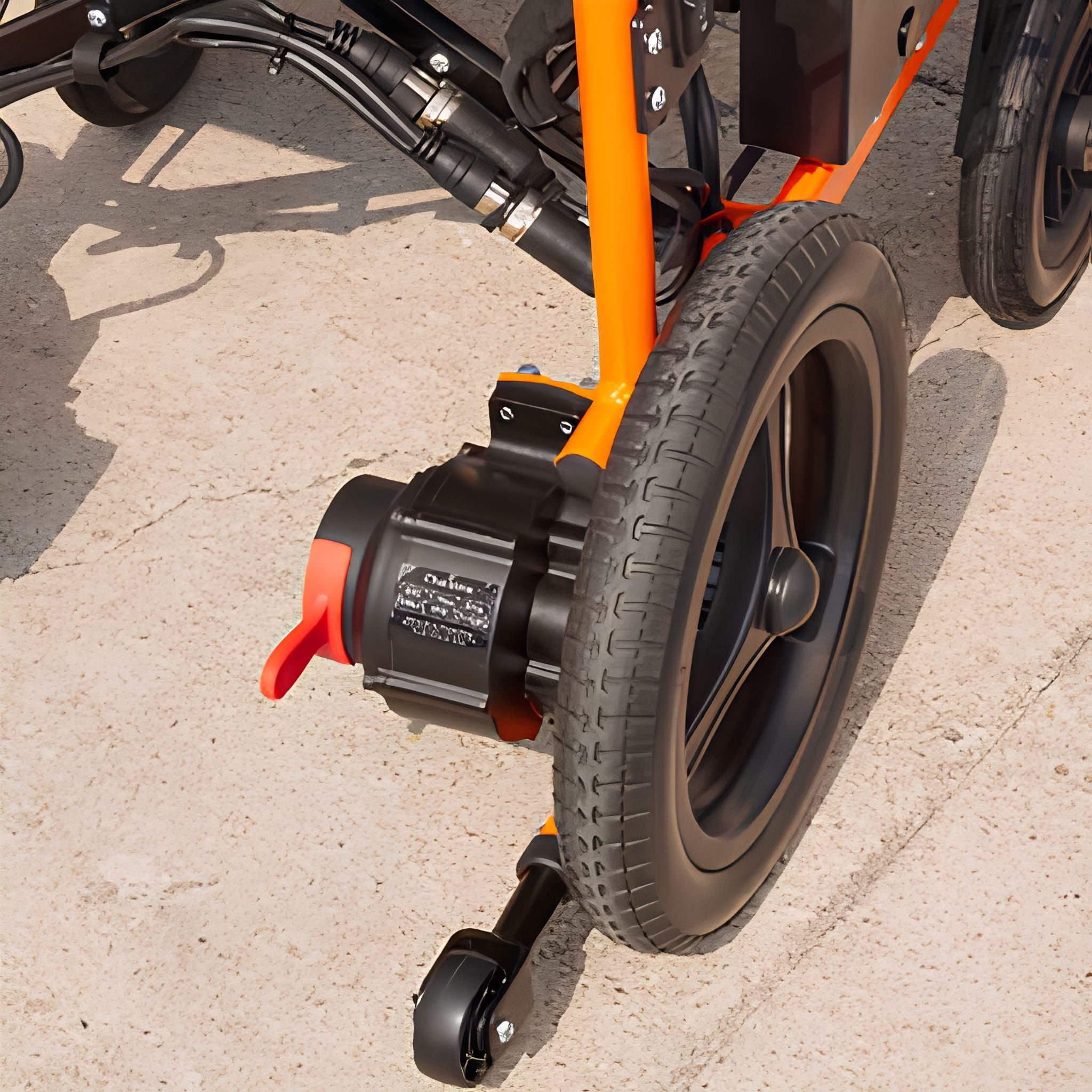 Close-up of the OAS Air Ultra rear drive motor with electromagnetic brake, tire, and anti-tip caster wheel
