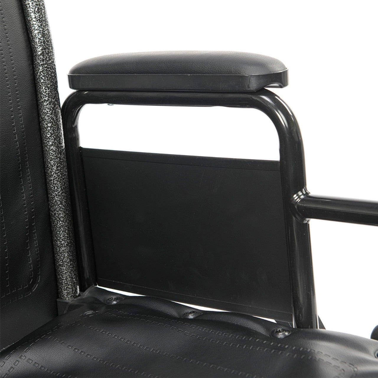 Close-up of removable desk-length padded armrest on Chariot II bariatric wheelchair designed for easier wheelchair transfers and accessible seated positioning.