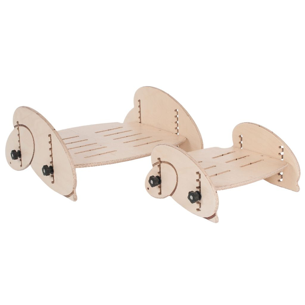 Two natural wood Smirthwaite Juni footrests shown in different sizes for supporting a child's feet.