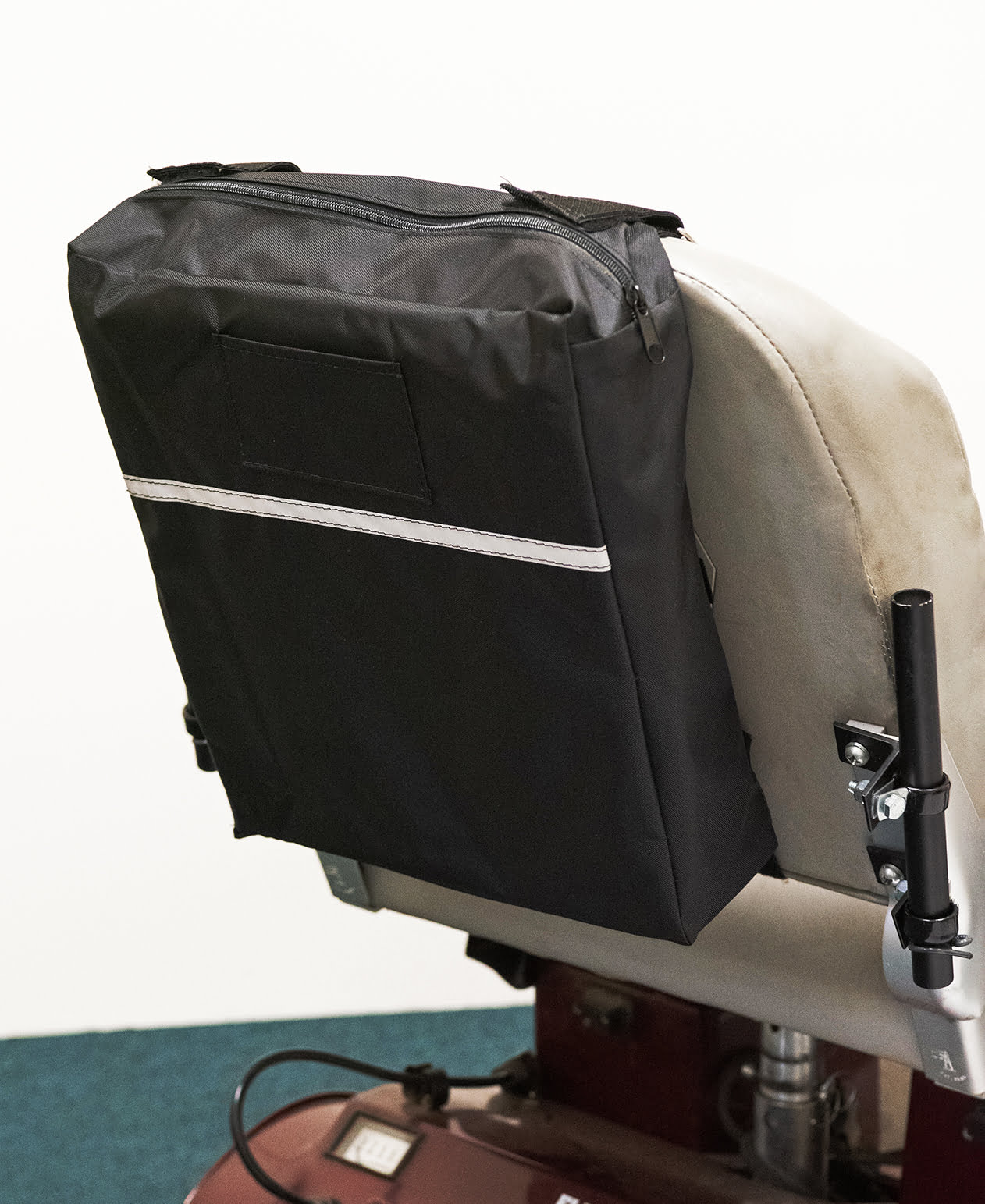 Diestco Standard Seatback Bag mounted on a mobility scooter captain seatback with a reflective strip