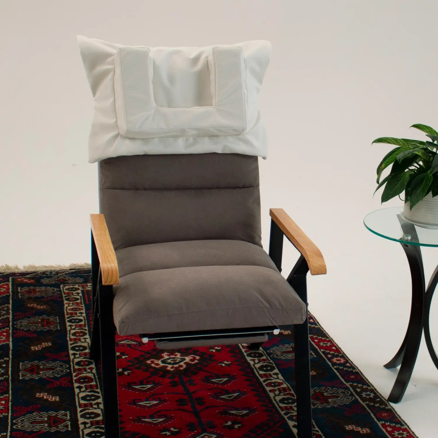 Ivory Tausi Horizontal Support System secured to a chair for upright neck and head support