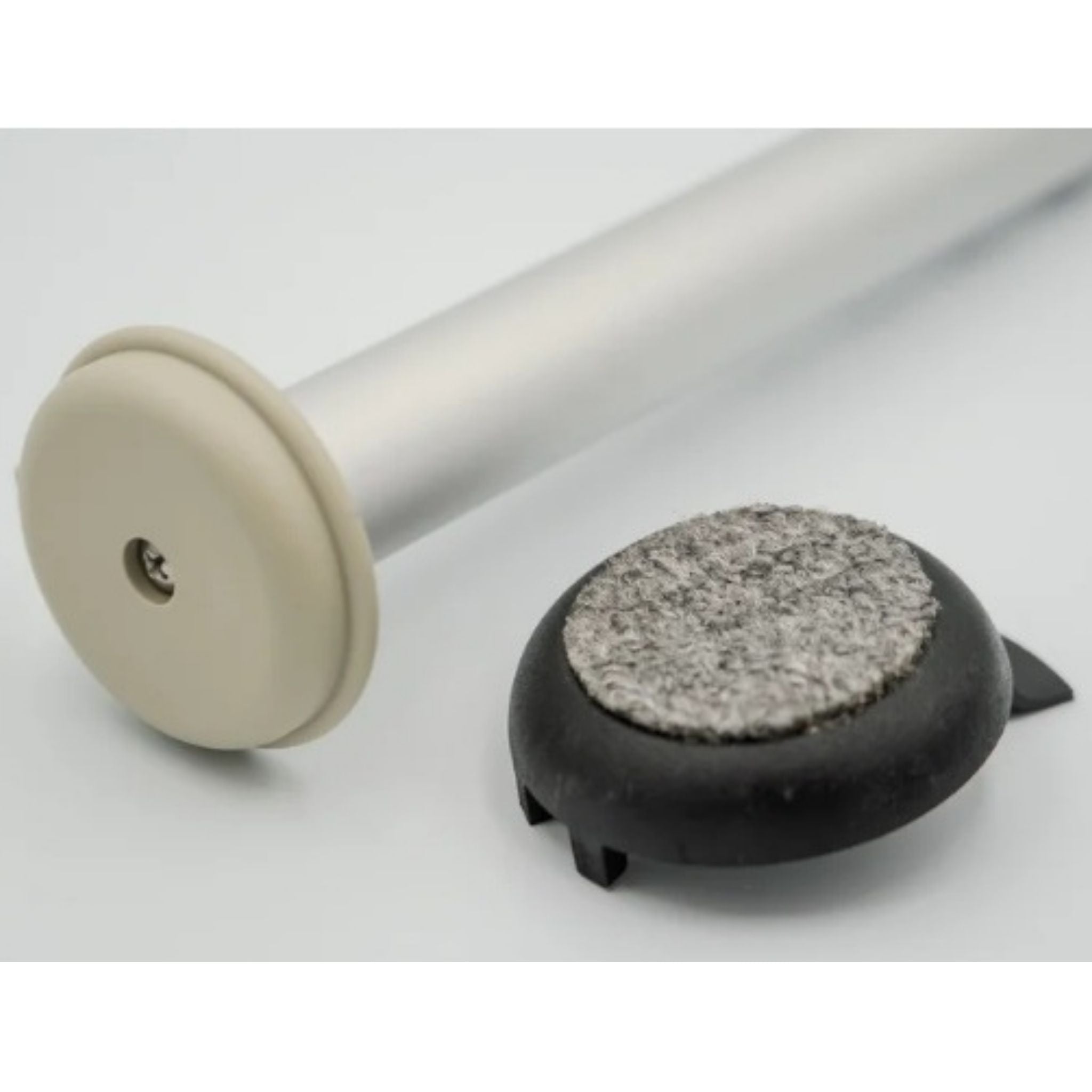 Versa Coast walker footing with detached carpeted indoor coaster beside hard-surface outdoor glide, demonstrating removable dual-surface design.