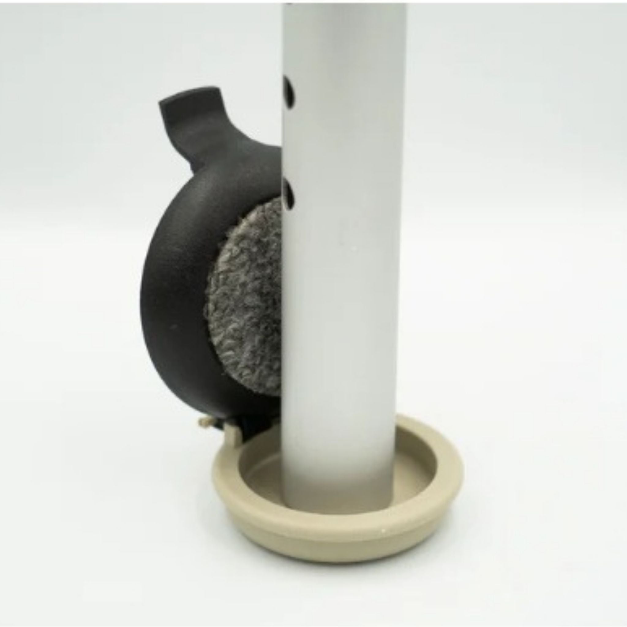 Versa Select hinged walker footing with carpeted coaster flipped upward, revealing hard-surface outdoor glide for sidewalks, asphalt, and concrete.