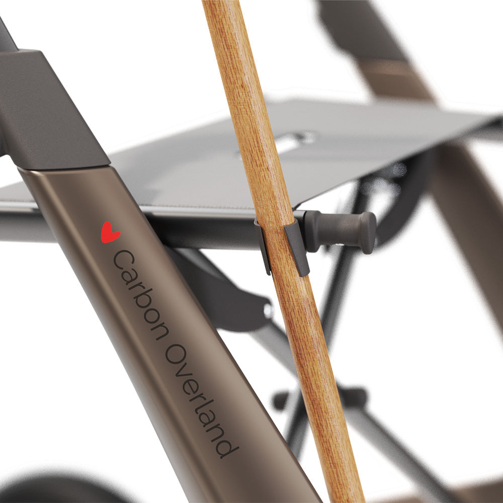 byACRE Carbon Overland cane holder lower mount securely holds a walking cane on the rollator frame