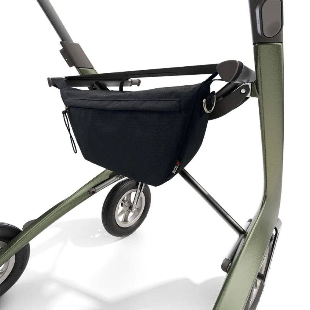 Black byACRE Pocket Bag mounted under the seat of an olive green byACRE rollator, close-up in use