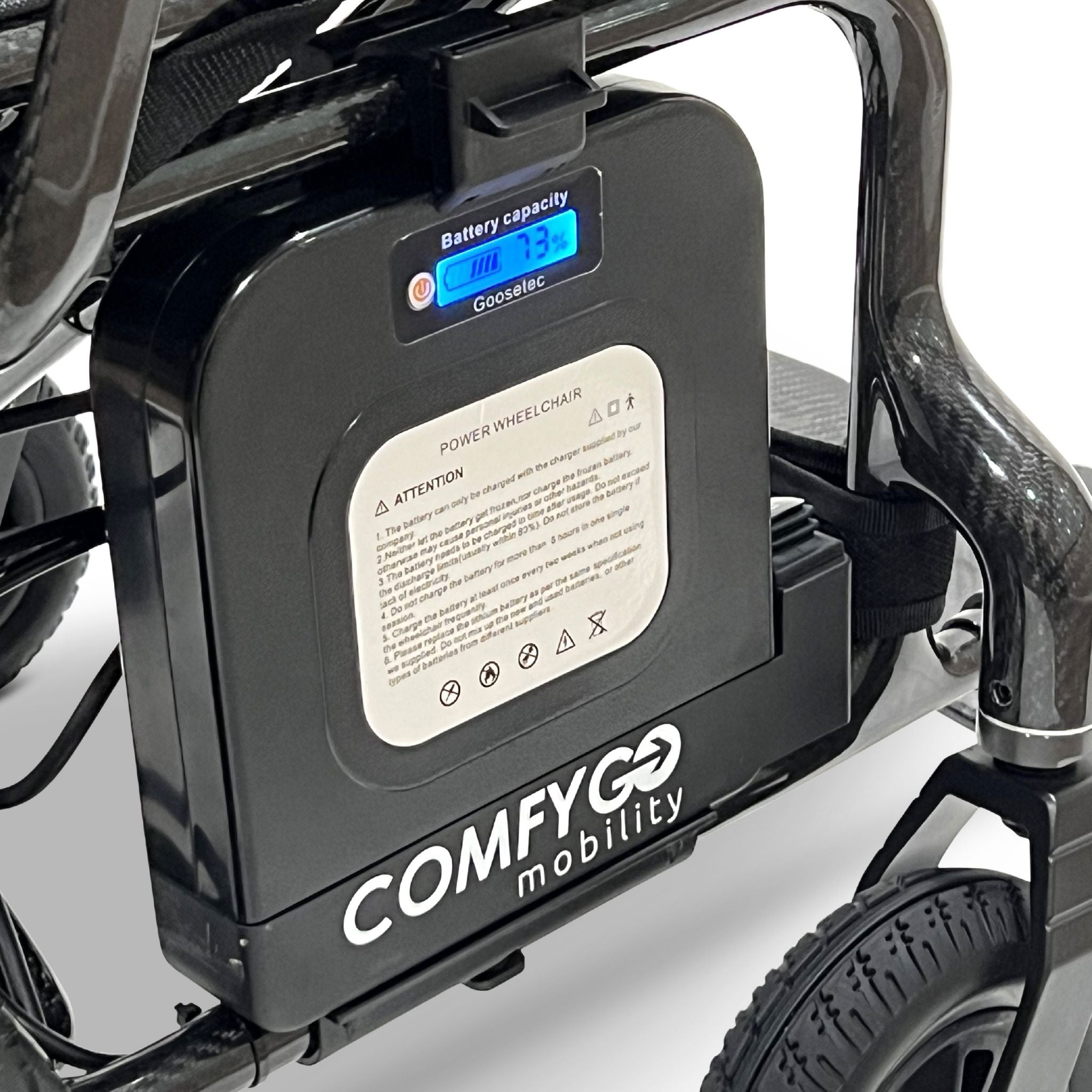 Close-up of the removable lithium battery pack on the ComfyGO Phoenix Carbon electric wheelchair featuring digital battery capacity display, quick-release design, and lightweight travel-ready power system.