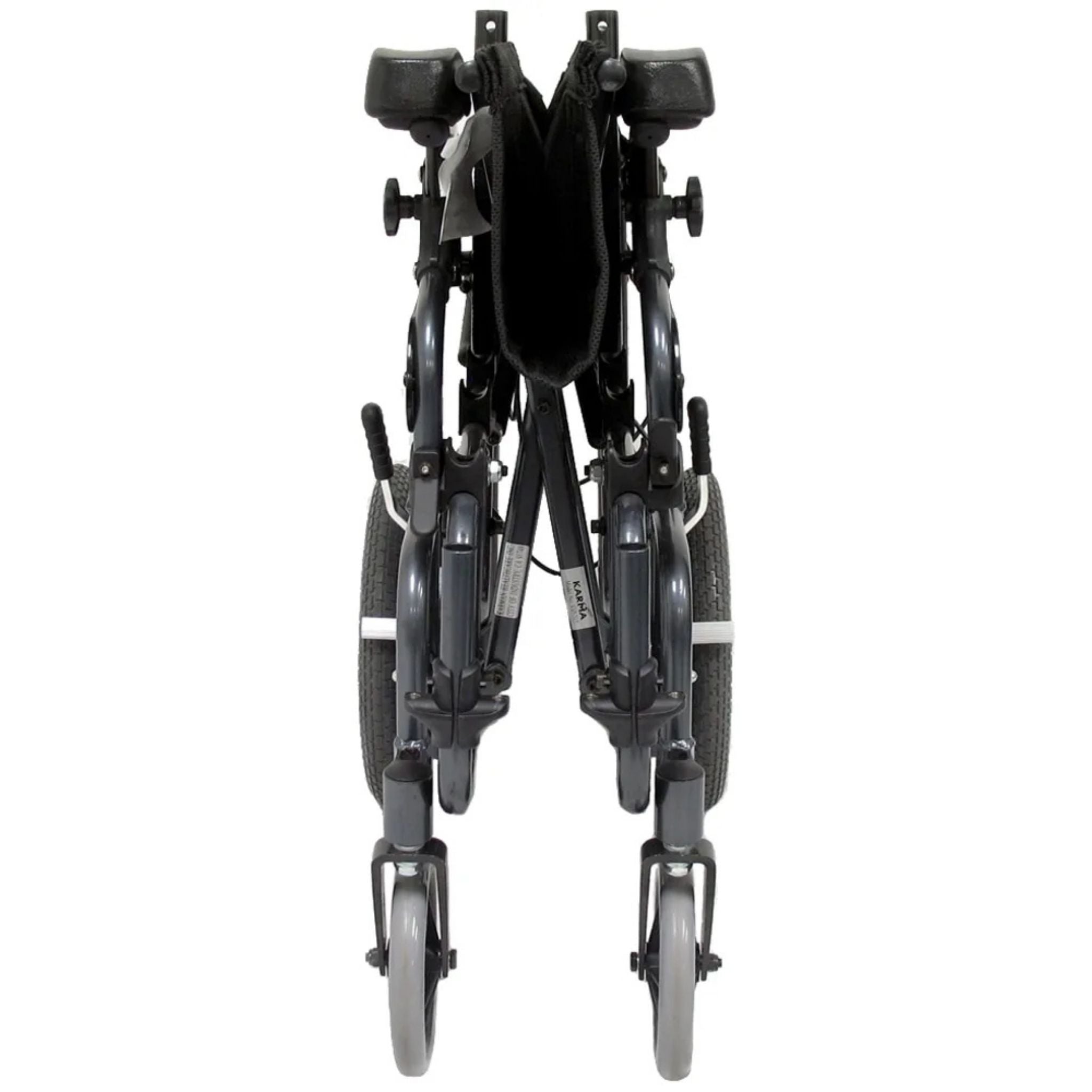 Front view of the folded Karman VIP-515-TP tilt-in-space reclining wheelchair showing compact transport and storage configuration on a white background