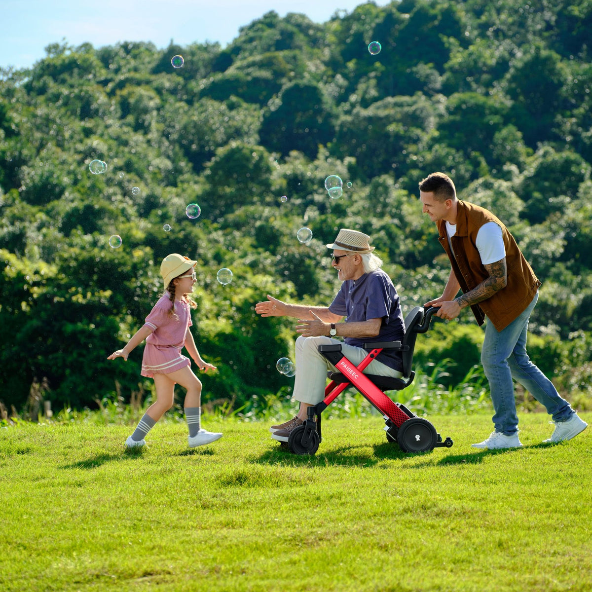 Grandfather in a red Paiseec W3 electric wheelchair playing ball with his grandchildren in a park