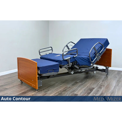 ActiveCare Fixed bed in auto contour position with head section raised, side rails, and cherry wood bed ends