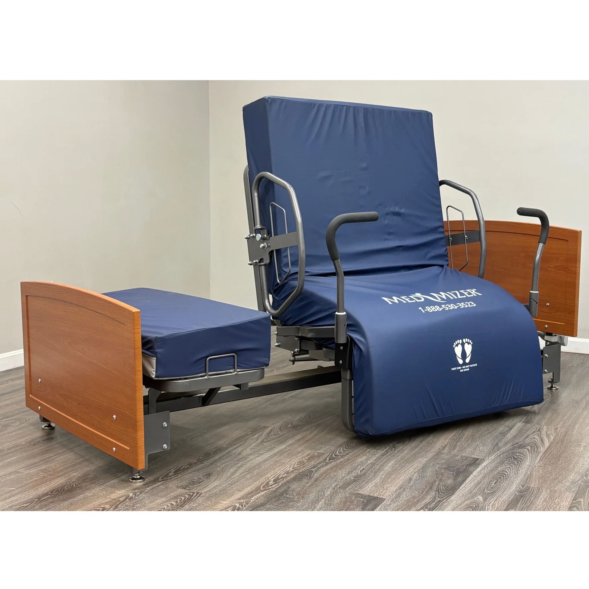 ActiveCare Fixed rotating bed in upright SafeTurn chair position with padded mobility bar handles for supported standing