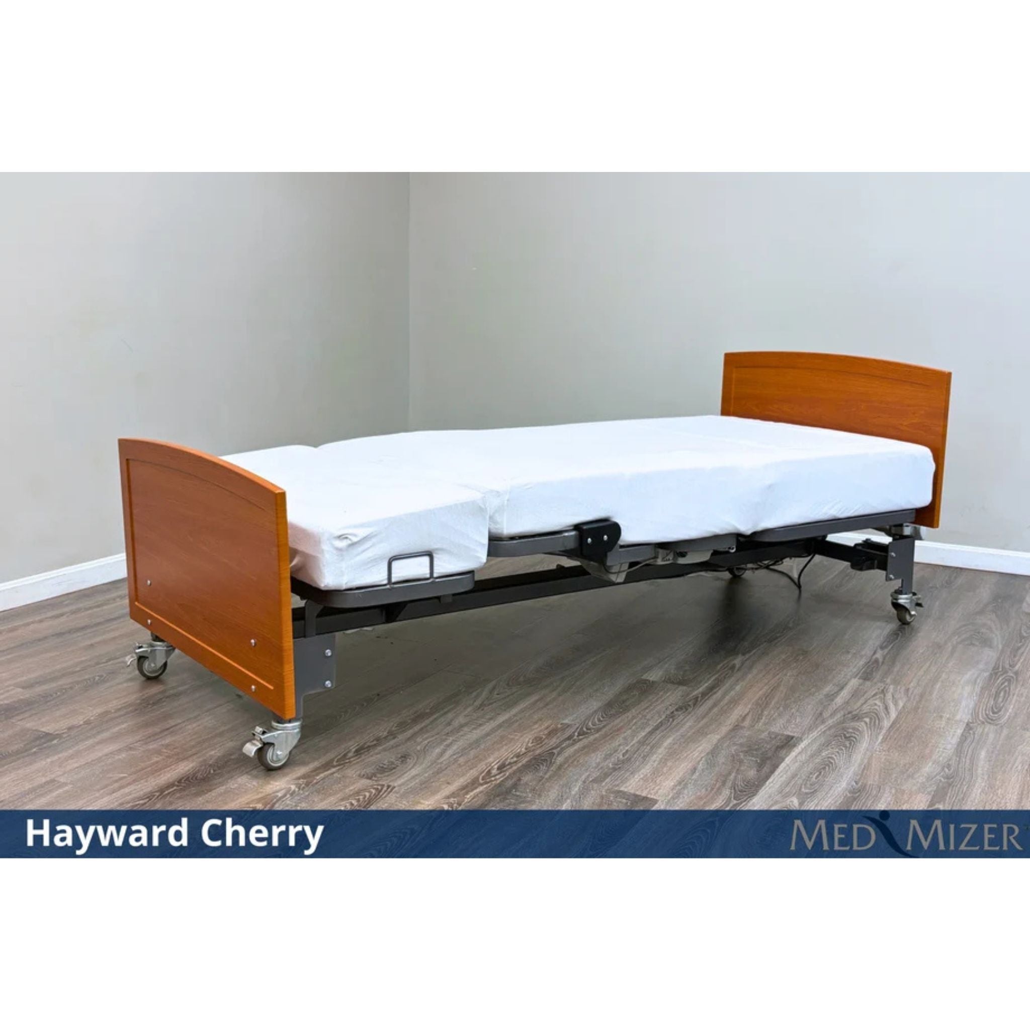 Med-Mizer ActiveCare Fixed height hospital bed flat with Hayward Cherry wood headboard and footboard on casters