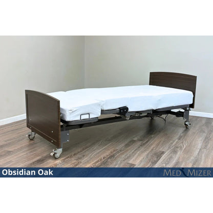 Med-Mizer ActiveCare Fixed height hospital bed flat with dark Obsidian Oak wood headboard and footboard on casters