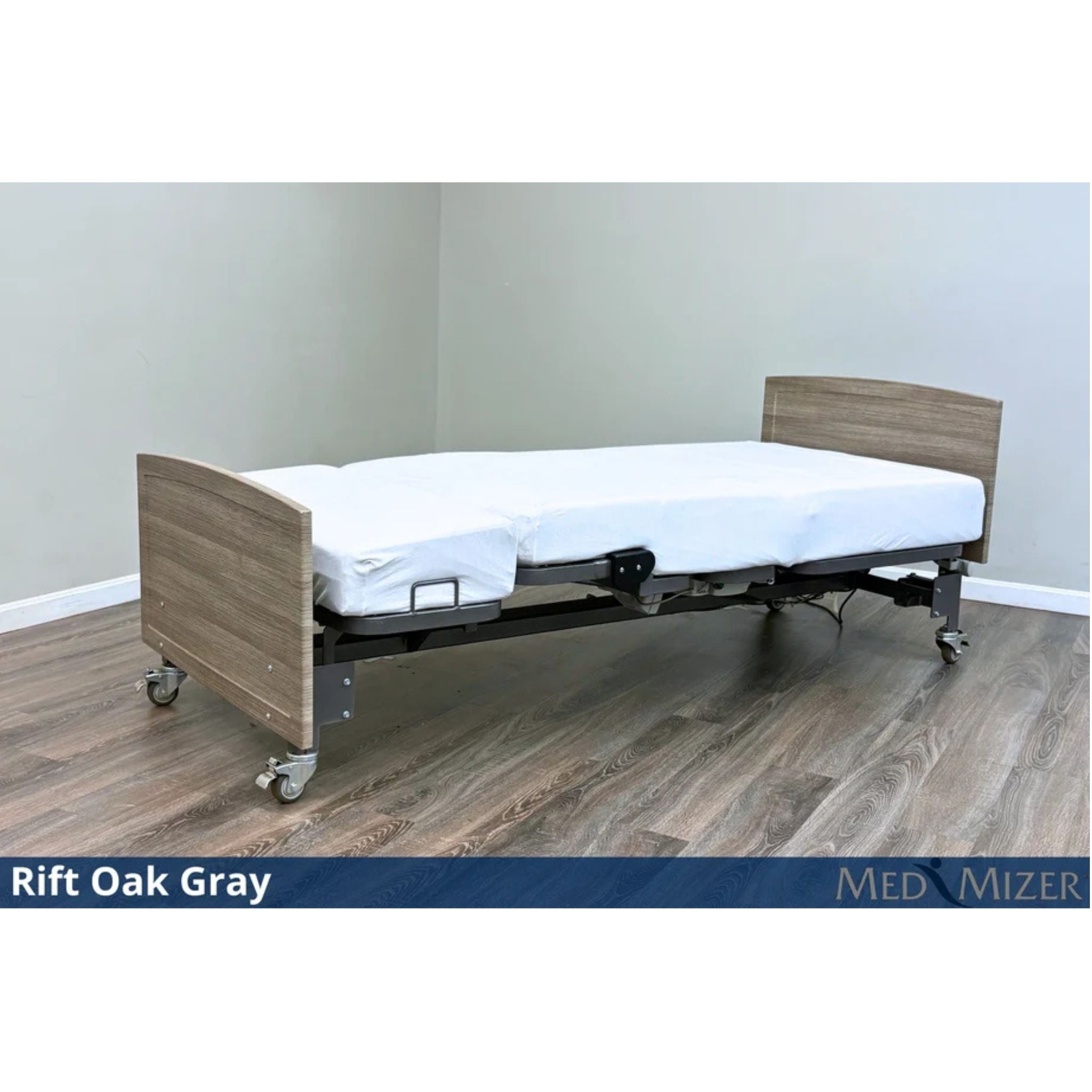 Med-Mizer ActiveCare Fixed height hospital bed flat with light Rift Oak Gray wood headboard and footboard on casters