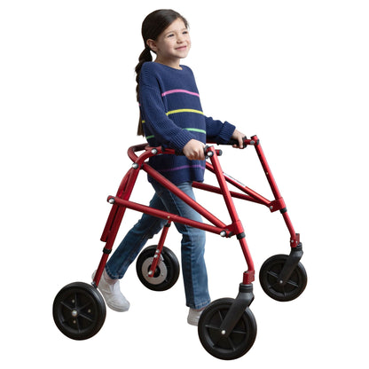 Smiling girl walking upright with a red Circle Specialty Klip posterior gait trainer