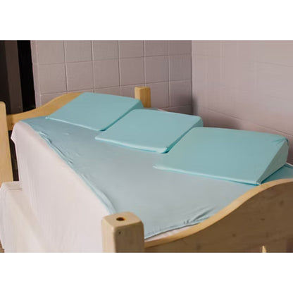 Cloud 9 Care positioning sheet installed on a twin bed with three medical-grade foam wedges
