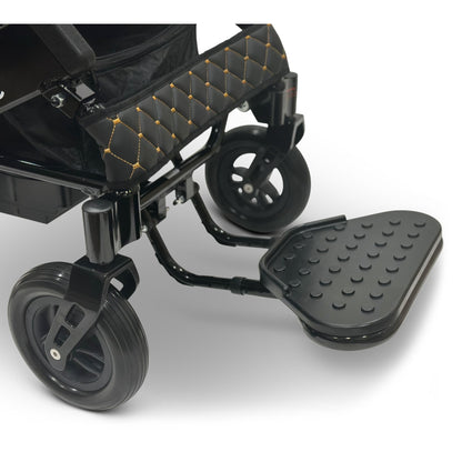 Close-up of the foldable footplate and front caster wheel on the ComfyGO MAJESTIC IQ-8000 electric wheelchair