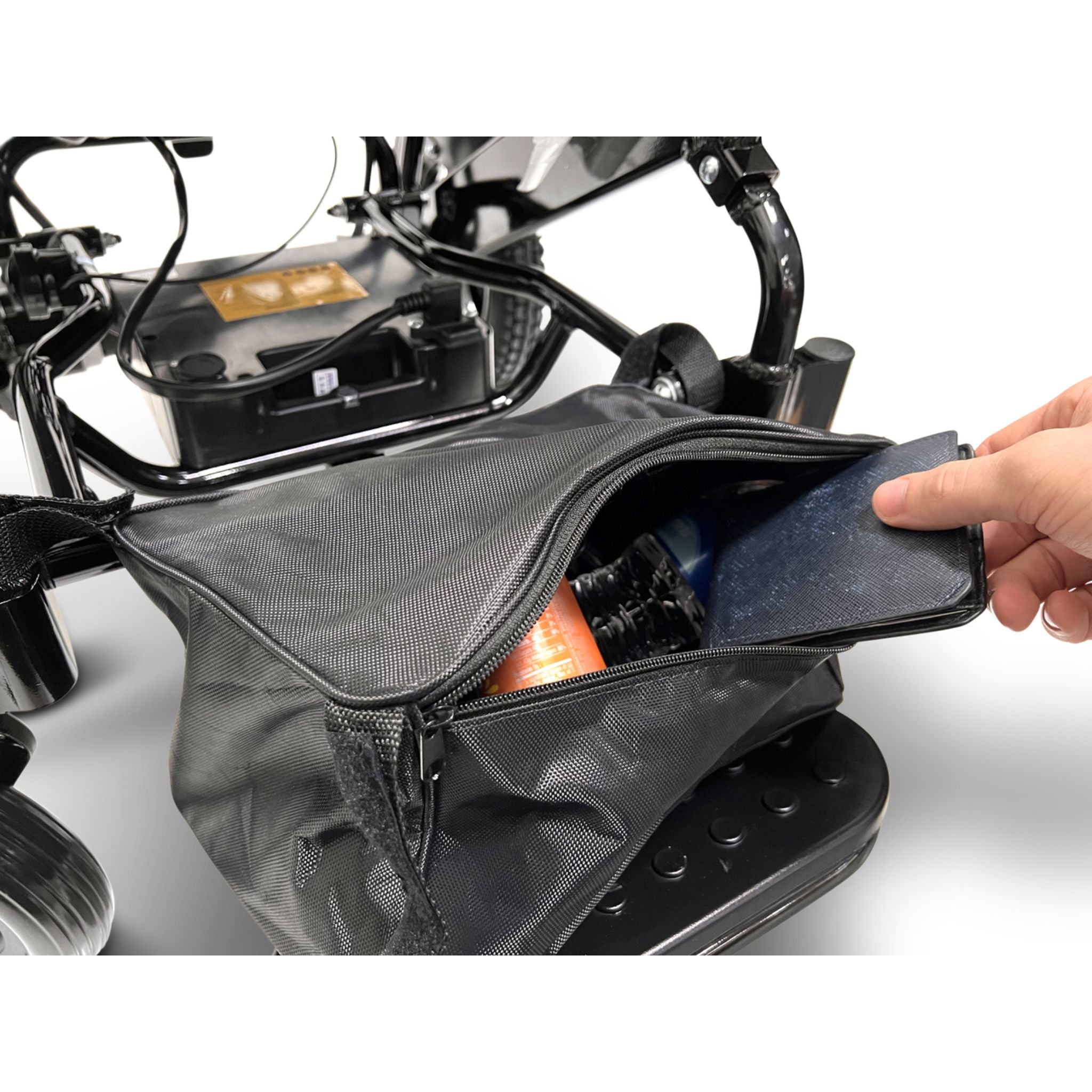 Under-seat storage bag on the ComfyGO MAJESTIC IQ-8000 lightweight folding electric wheelchair holding personal belongings