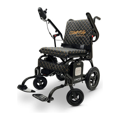 Front angle view of the ComfyGO Phoenix Carbon Fiber electric wheelchair featuring an ultra-lightweight folding carbon fiber frame, ergonomic quilted seating, joystick controller, airline-approved batteries, and compact travel-ready design.