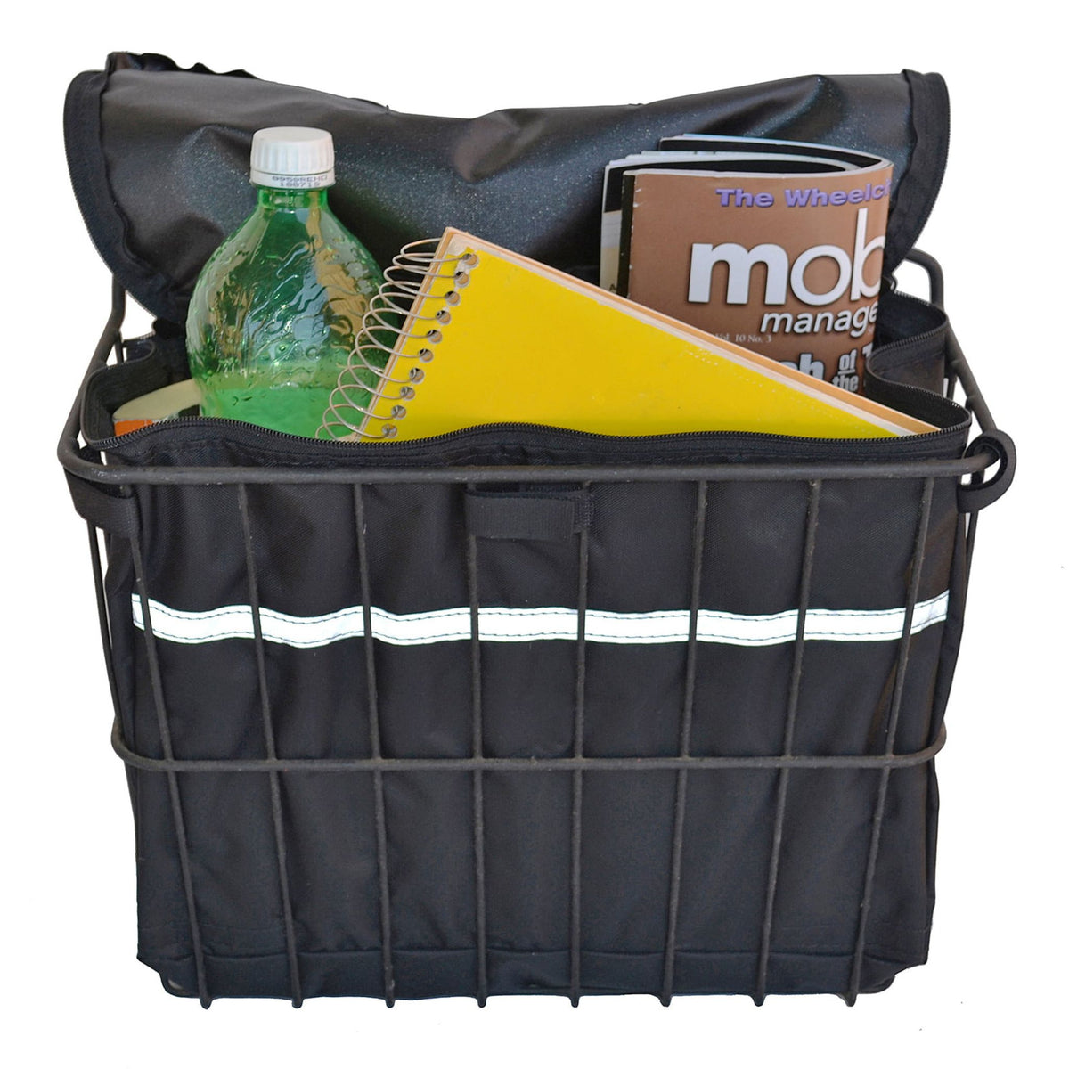 Diestco Basket Liner fitted inside a wire scooter basket with the zippered top open, holding a water bottle, spiral notebook, and magazine, with reflective strip on the front