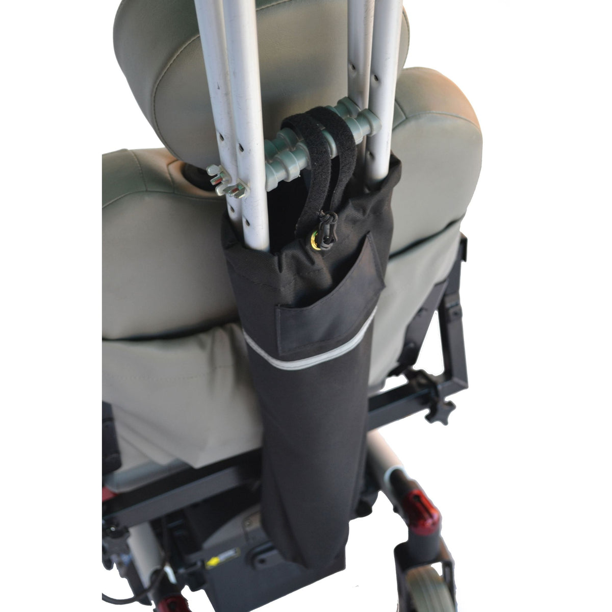 Close-up of the Diestco Crutch Holder on a power wheelchair seatback, with crutches secured by the drawstring top and hook-and-loop strap