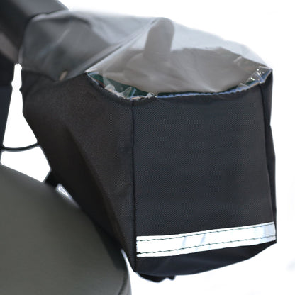 Diestco power wheelchair joystick cover in black water-resistant fabric with clear vinyl window over the controls and reflective strip, shown mounted on an armrest