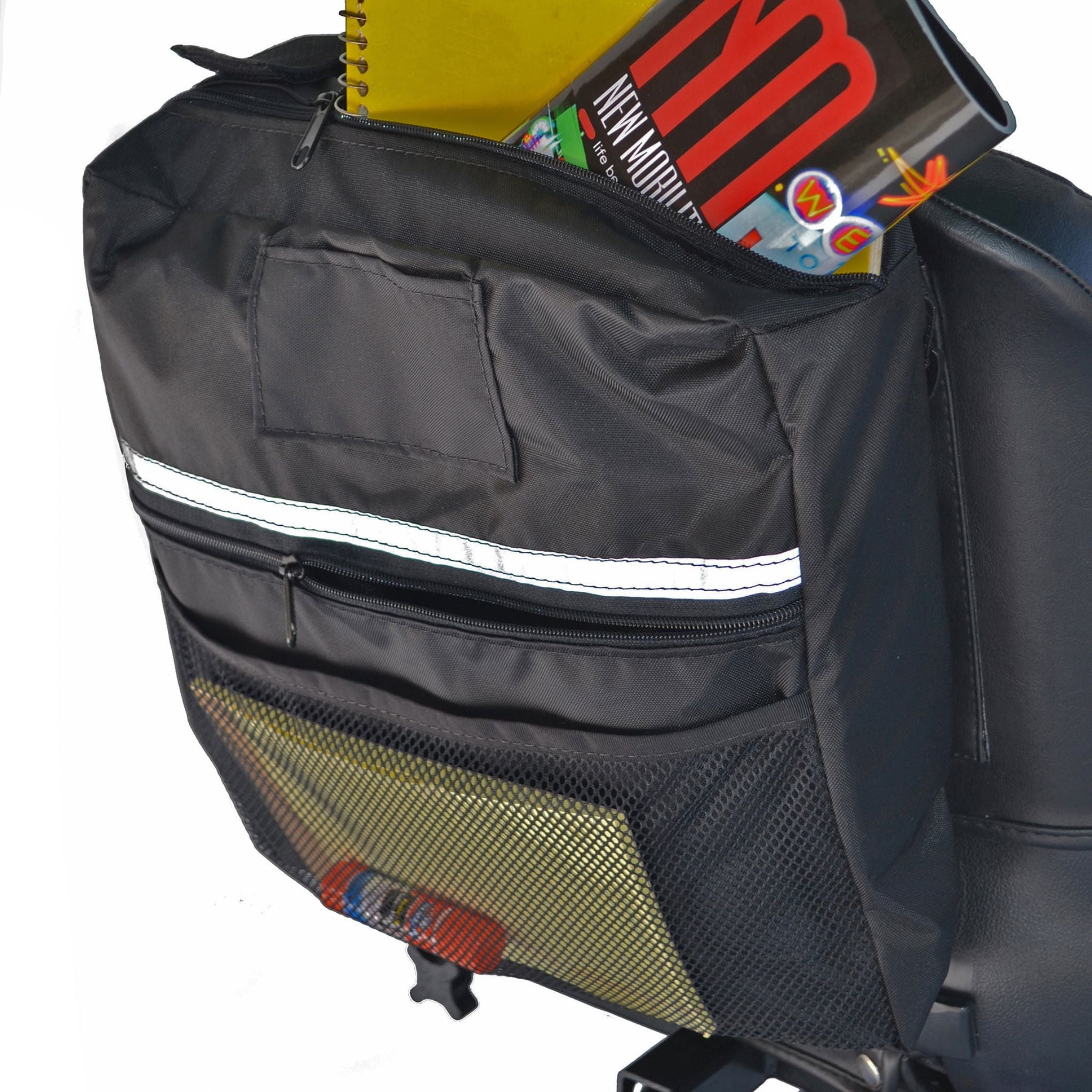 Side view of the Diestco Mid-Range Seatback Bag on a captain seat showing the adjustable mounting strap and pockets