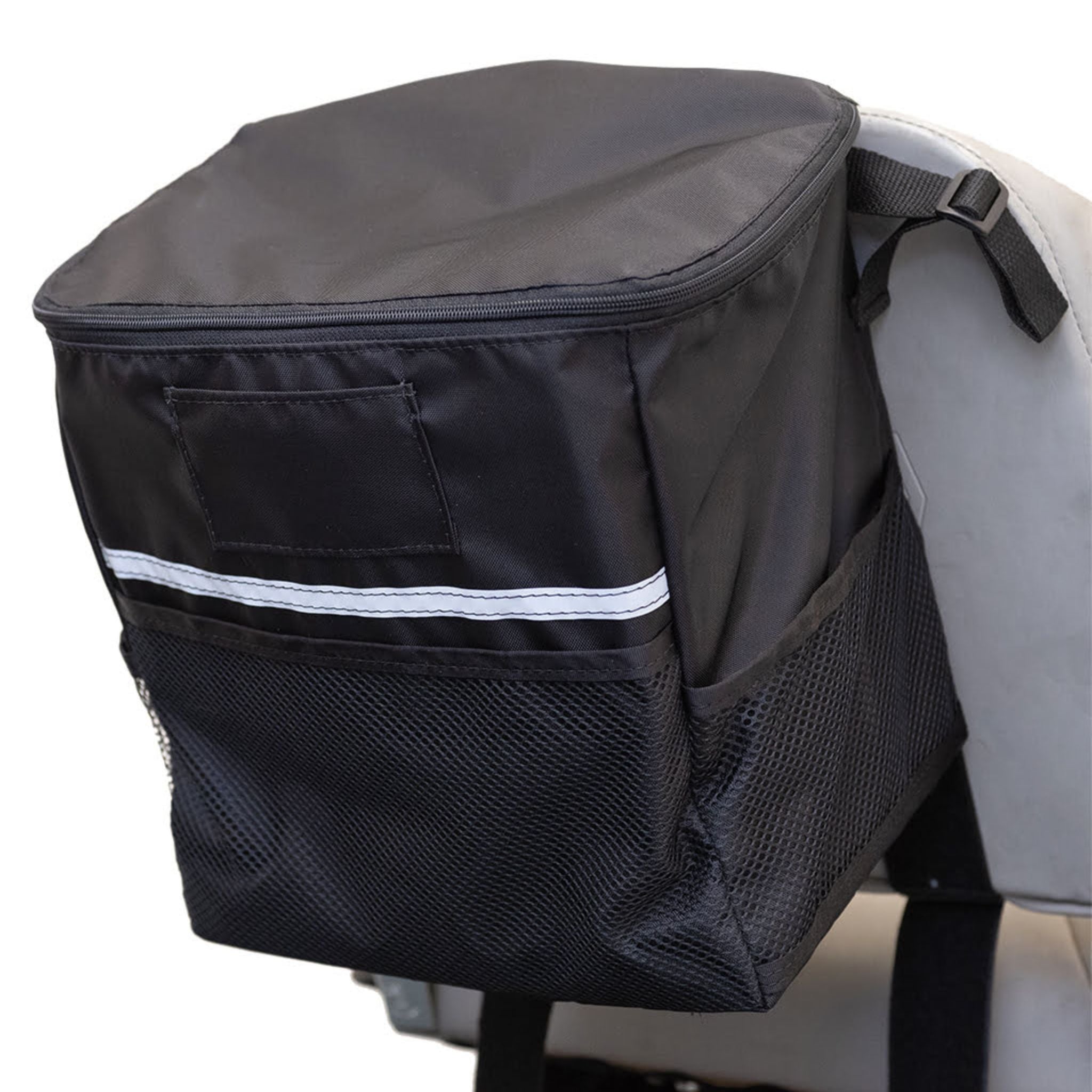 Side view of the closed Diestco Mini Monster Bag on a seatback showing the ID pocket, reflective strip, and mesh pockets