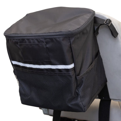 Side view of the closed Diestco Mini Monster Bag on a seatback showing the ID pocket, reflective strip, and mesh pockets